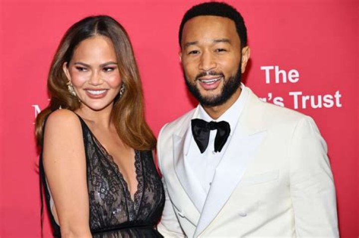 Chrissy Teigen Goes Hiking In A Stylish Black Swimsuit With John Legend During Much Needed Vacation